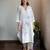 Off-white chanderi floral applique kurta set with pants, stitched