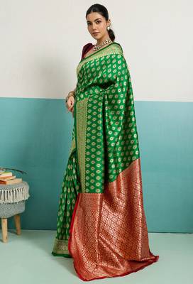 green banarasi silk blend zari woven with jaal saree with blouse 1