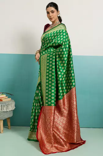 green banarasi silk blend zari woven with jaal saree with blouse