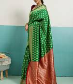 green banarasi silk blend zari woven with jaal saree with blouse