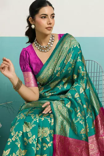 rama green banarasi silk blend zari woven with jaal saree with blouse
