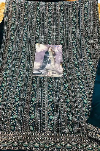 Teal heavy rangoli with coading sequence work unstitched suit