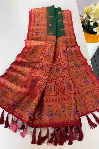 dark green color zari weaves and meenakari work in border having contrast pallu silk blend saree