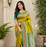 olive green color zari weaves and meenakari work in border having contrast pallu silk blend saree
