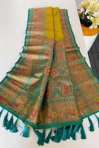 olive green color zari weaves and meenakari work in border having contrast pallu silk blend saree