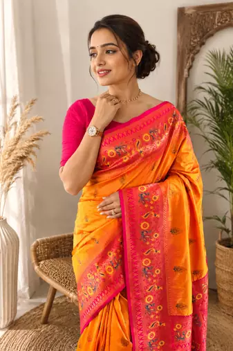 orange color zari weaves and meenakari work in border having contrast pallu silk blend saree