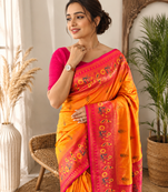 orange color zari weaves and meenakari work in border having contrast pallu silk blend saree