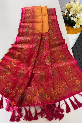 orange color zari weaves and meenakari work in border having contrast pallu silk blend saree
