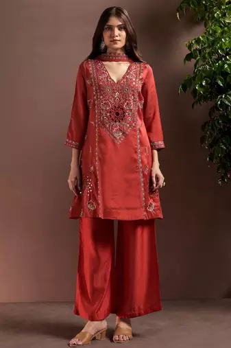 Rust silk blend embroidered mirror work ethnic kurta set with matching dupatta