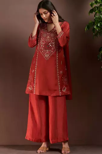 Rust silk blend embroidered mirror work ethnic kurta set with matching dupatta