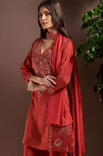 Rust silk blend embroidered mirror work ethnic kurta set with matching dupatta