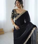 Black tissue satin embrloidered saree with unstitched blouse piece.