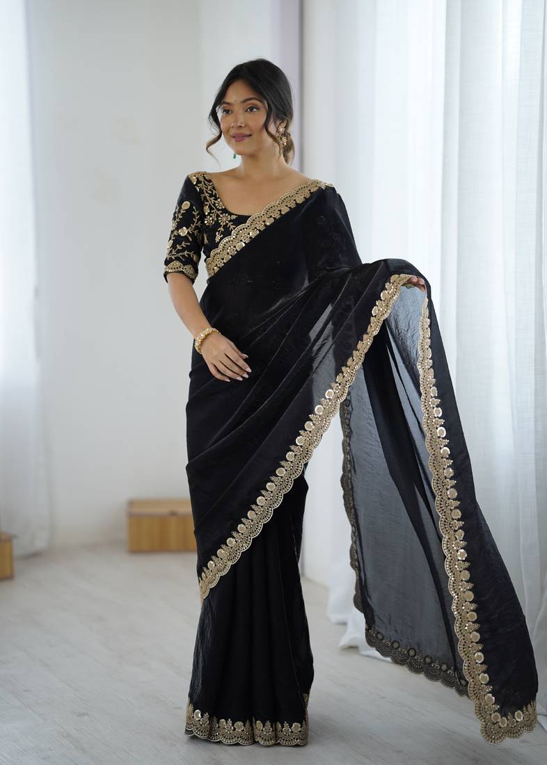 Black tissue satin embrloidered saree with unstitched blouse piece.