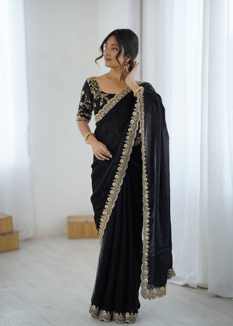 Black tissue satin embrloidered saree with unstitched blouse piece.
