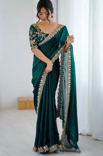 Bottle green tissue satin embrloidered saree with unstitched blouse piece.