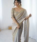 Grey tissue satin embrloidered saree with unstitched blouse piece.