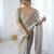 Grey tissue satin embrloidered saree with unstitched blouse piece.
