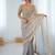 Grey tissue satin embrloidered saree with unstitched blouse piece.
