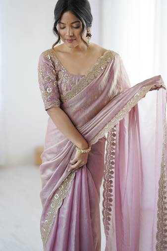 Pink tissue satin embrloidered saree with unstitched blouse piece.