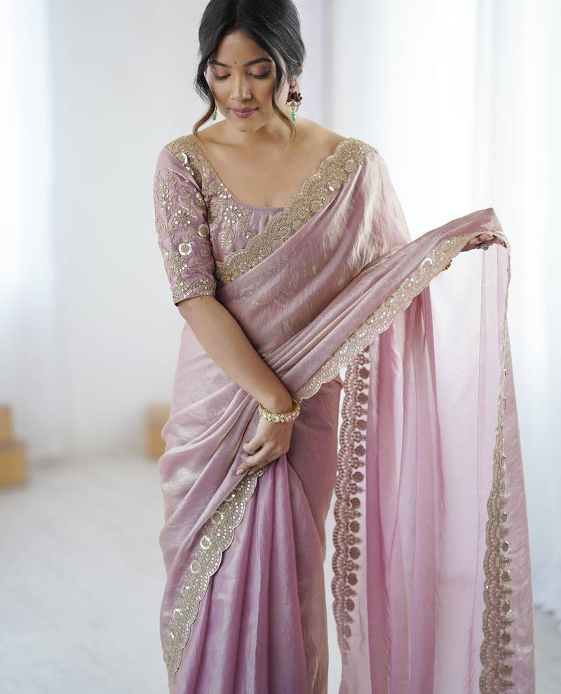 Pink tissue satin embrloidered saree with unstitched blouse piece.