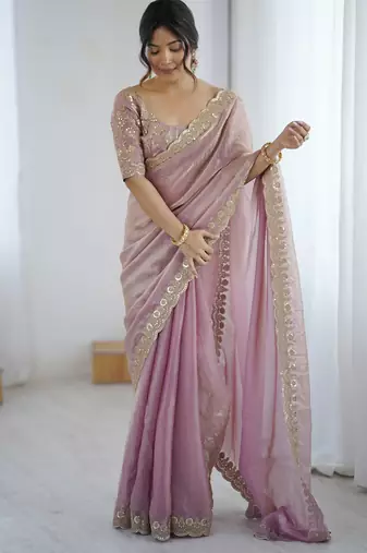 Pink tissue satin embrloidered saree with unstitched blouse piece.