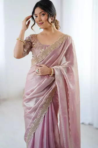 Pink tissue satin embrloidered saree with unstitched blouse piece.