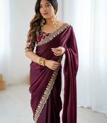 Wine tissue satin embrloidered saree with unstitched blouse piece.