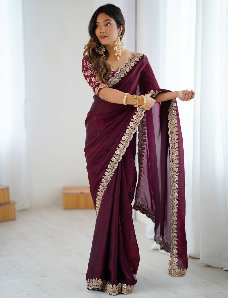 Wine tissue satin embrloidered saree with unstitched blouse piece.