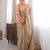 Beige tissue satin sequins saree with unstitched blouse piece.