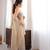 Beige tissue satin sequins saree with unstitched blouse piece.