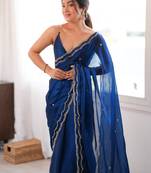 Blue tissue satin sequins saree with unstitched blouse piece.