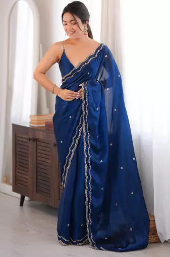 Blue tissue satin sequins saree with unstitched blouse piece.