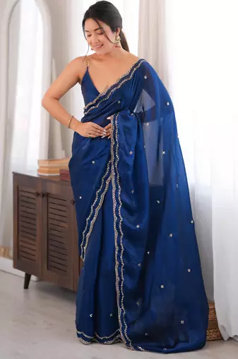 Blue tissue satin sequins saree with unstitched blouse piece.