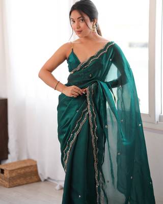 Bottle green tissue satin sequins saree with unstitched blouse piece. 1