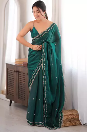 Bottle green tissue satin sequins saree with unstitched blouse piece.