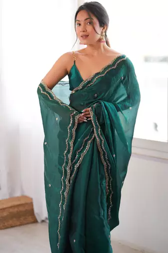Bottle green tissue satin sequins saree with unstitched blouse piece.