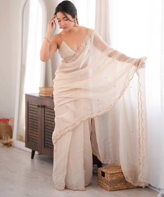 Cream tissue satin sequins saree with unstitched blouse piece. 2