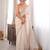 Cream tissue satin sequins saree with unstitched blouse piece.