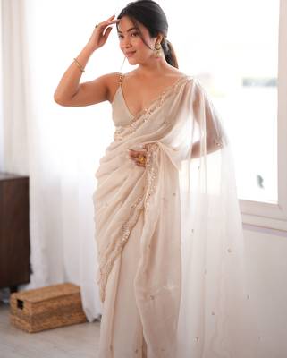 Cream tissue satin sequins saree with unstitched blouse piece. 4