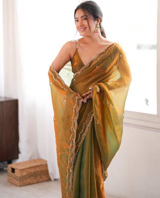 Gold tissue satin sequins saree with unstitched blouse piece. 1