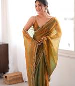 Gold tissue satin sequins saree with unstitched blouse piece.