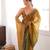 Gold tissue satin sequins saree with unstitched blouse piece.
