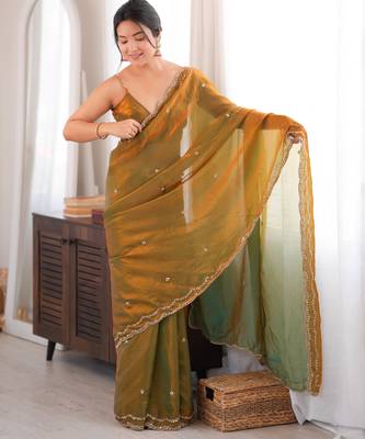 Gold tissue satin sequins saree with unstitched blouse piece. 3