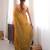 Gold tissue satin sequins saree with unstitched blouse piece.