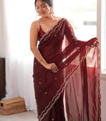 Maroon tissue satin sequins saree with unstitched blouse piece.