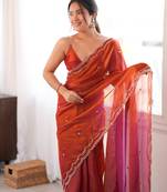 Orange tissue satin sequins saree with unstitched blouse piece.