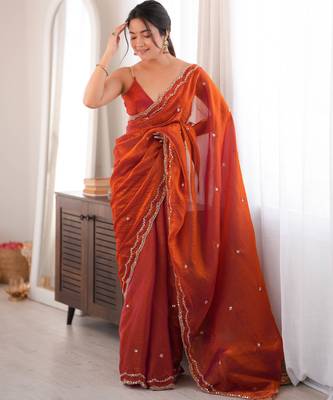 Orange tissue satin sequins saree with unstitched blouse piece. 2