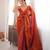 Orange tissue satin sequins saree with unstitched blouse piece.