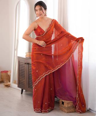 Orange tissue satin sequins saree with unstitched blouse piece. 3