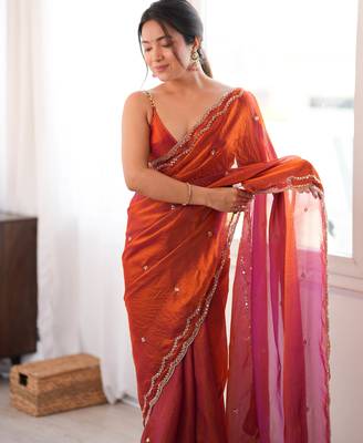Orange tissue satin sequins saree with unstitched blouse piece. 4